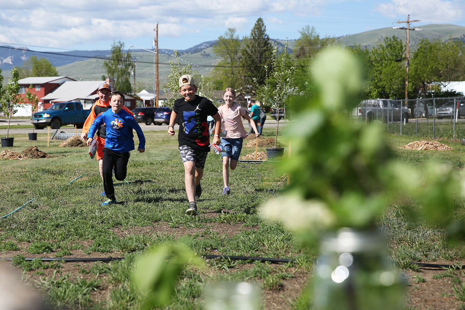 A group of kids races to their next station